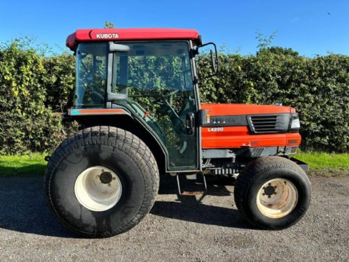 Kubota L4200 compact tractor fitted with wide flotation wheels for sale